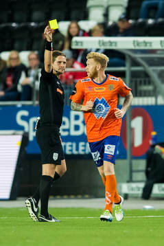 Fredrik Kjernmoen Carlsen of Aalesund is shown a yellow