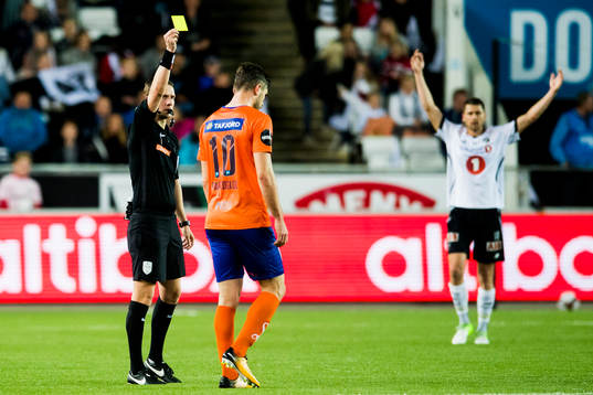 Athanasios Papazoglou of Aalesund is shown a yellow card by