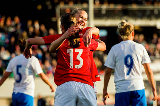 Guro Reiten of Norway celebrates with her teammate