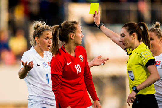 Jana Vojtekova of Slovakia is shown a yellow card by The