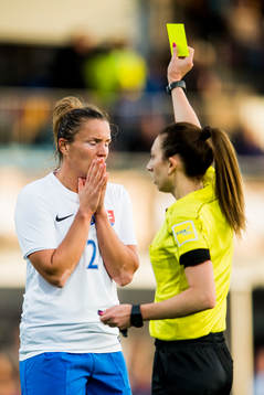 Lucie Harsanyova of Slovakia is shown a yellow card by The