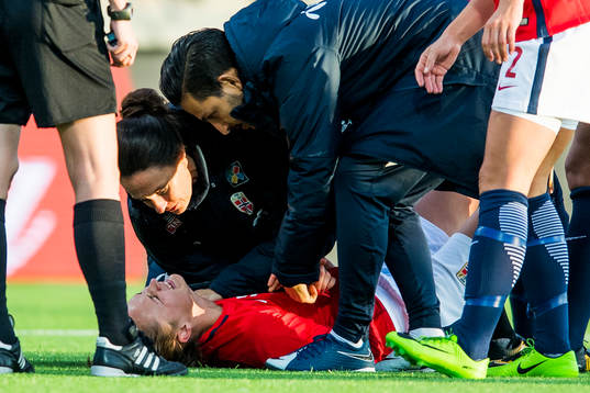 Caroline Graham Hansen of Norway receives treatment for an