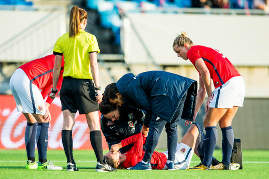 Caroline Graham Hansen of Norway receives treatment for an