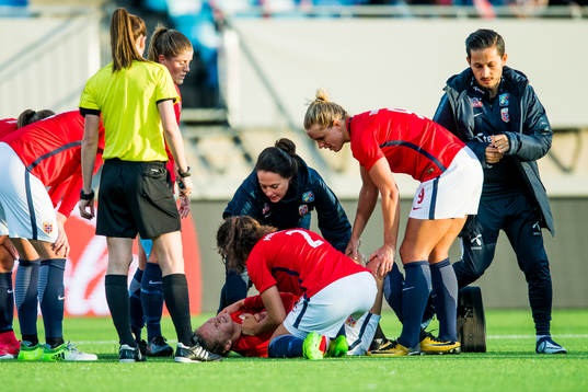 Caroline Graham Hansen of Norway receives treatment for an