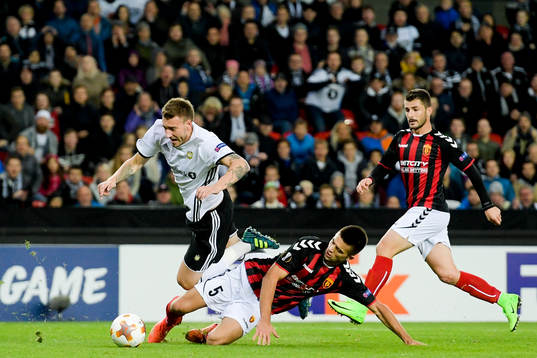 Nicklas Bendtner of Rosenborg is brought down by Visar