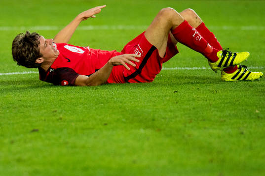 Jakob Orlov of Brann lies down with an injury