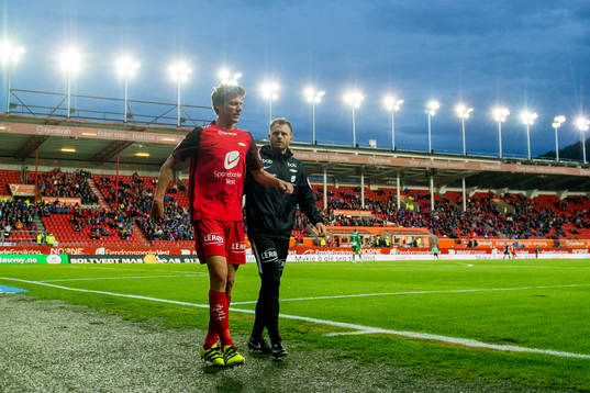 Jakob Orlov of Brann walks off the pitch with an injury