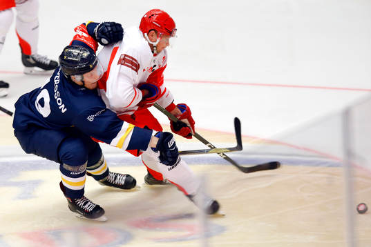 Erik Andersson of HV71 and Daniel Rakos of Ocelari Trinec