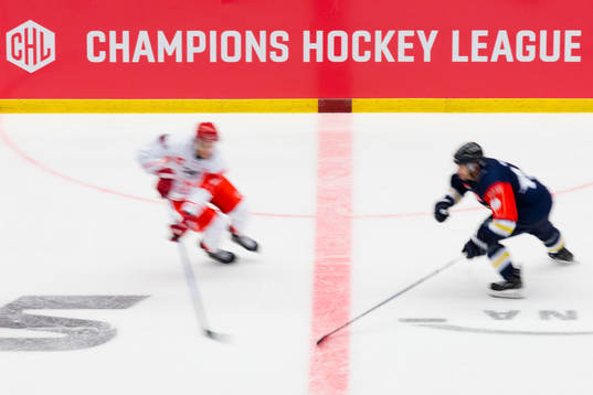 Players in front of the CHL logo