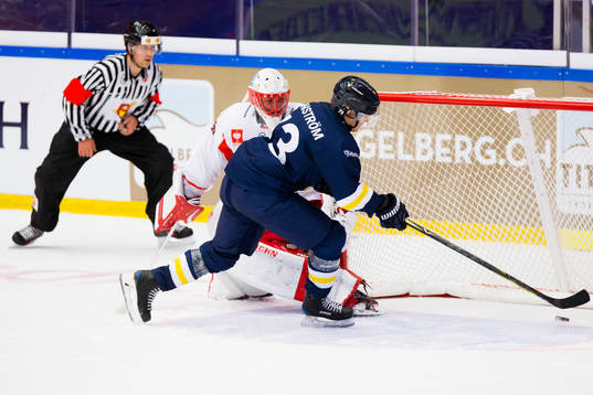 Sebastian Wännström of HV71 scores past Simon Hrubec