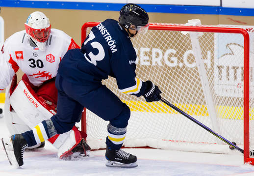 Sebastian Wännström of HV71 scores past Simon Hrubec