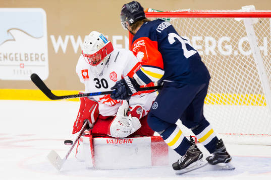 Simon Hrubec of Ocelari Trinec saves in front of Mattias