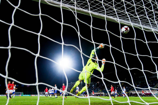 Ole Kristian Selnæs of Norway scores 6-0 behind goalkeeper