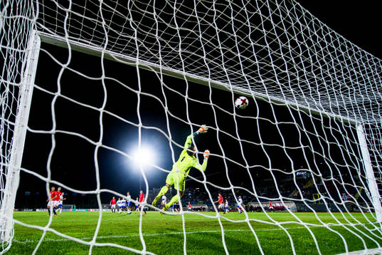 Ole Kristian Selnæs of Norway scores 6-0 behind goalkeeper