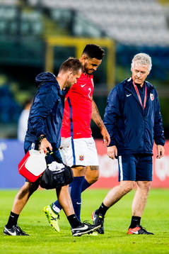 Joshua King of Norway walks off the pitch with an injury
