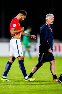 Joshua King of Norway walks off the pitch with an injury