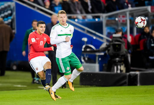 Mohamed Elyounoussi of Norway and Steven Davis of Northern