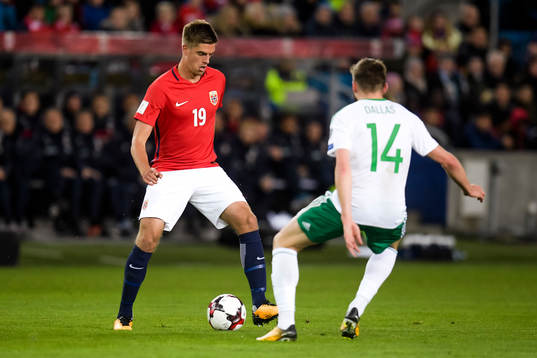 Markus Henriksen of Norway and Stuart Dallas of Northern