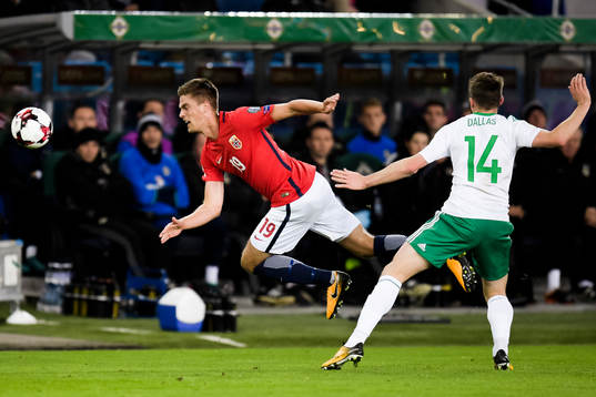 Markus Henriksen of Norway and Stuart Dallas of Northern