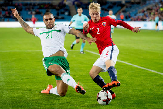 Josh Magennis of Northern Ireland and Birger Meling of
