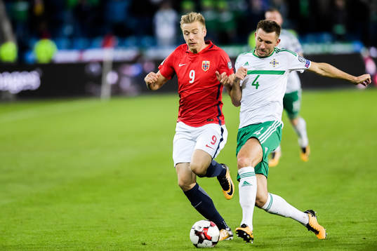 Alexander Toft Søderlund of Norway and Gareth McAuley of