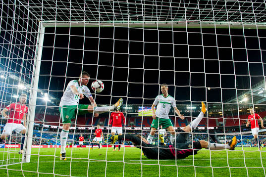 Chris Brunt of Northern Ireland scores an own goal