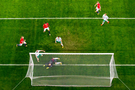 Chris Brunt of Northern Ireland scores an own goal