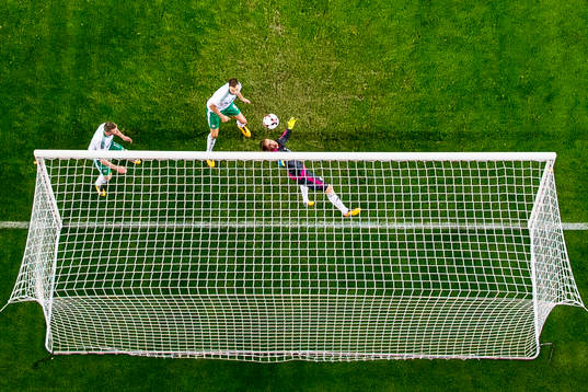 Chris Brunt of Northern Ireland scores an own goal