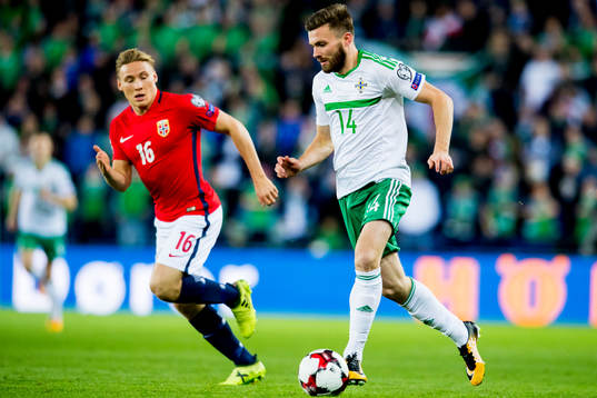 Jonas Svensson of Norway and Stuart Dallas of Northern