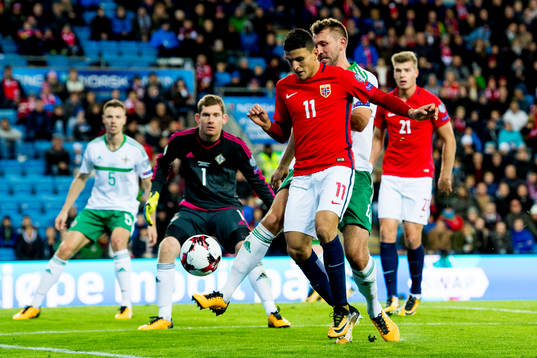 Mohamed "Moi" Elyounoussi of Norway and Gareth McAuley of