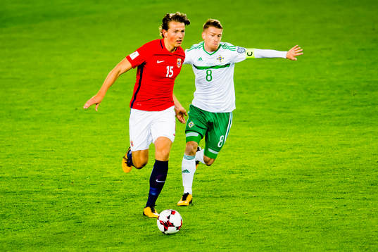 Sander Berge of Norway and Steven Davis of Northern Ireland