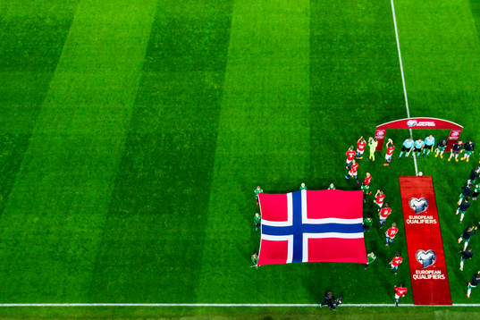 Players of both teams enter the pitch ahead the FIFA World