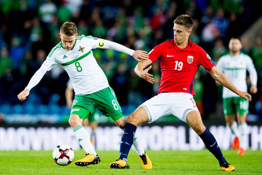 Steven Davis of Northern Ireland and Markus Henriksen of
