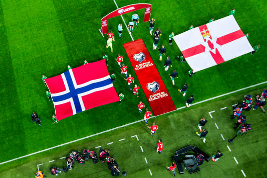 Players of both teams enter the pitch ahead the FIFA World