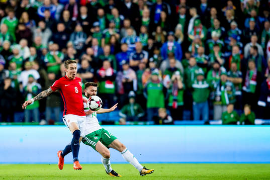 Stefan Johansen of Norway and Stuart Dallas of Northern