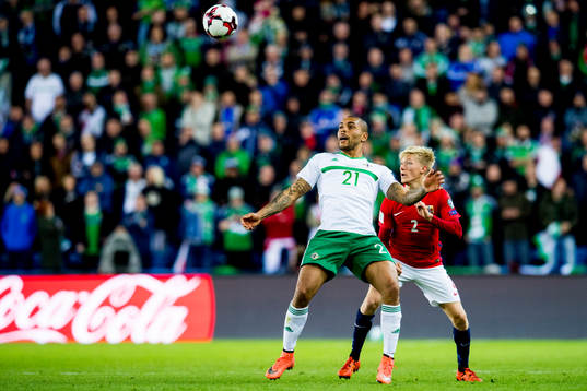 Josh Magennis of Northern Ireland and Birger Meling of