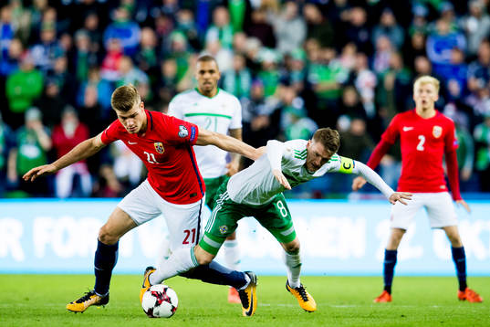 Alexander Sørloth of Norway and Steven Davis of Northern