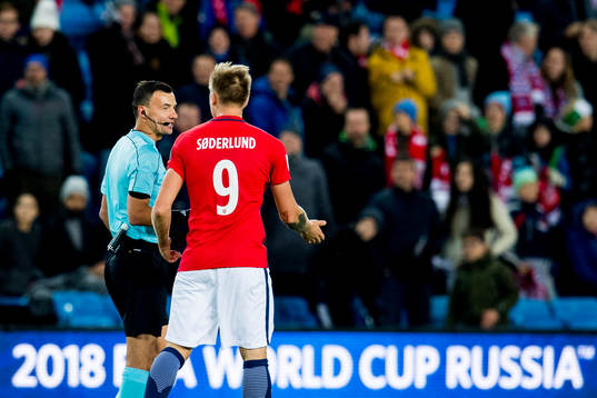 Alexander Toft Søderlund talks to referee Serhiy Boiko of
