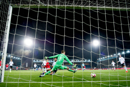 Morten Thorsby of Norway scores 1-1 behind goalkeeper