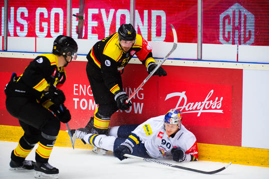 Marc Zanetti of Brynäs and Jerome Flaake of RB Munich