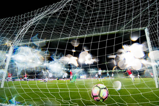 Martin Ødegaard of Norway scores 2-1 behind goalkeeper