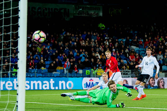 Martin Ødegaard of Norway scores 2-1 behind goalkeeper