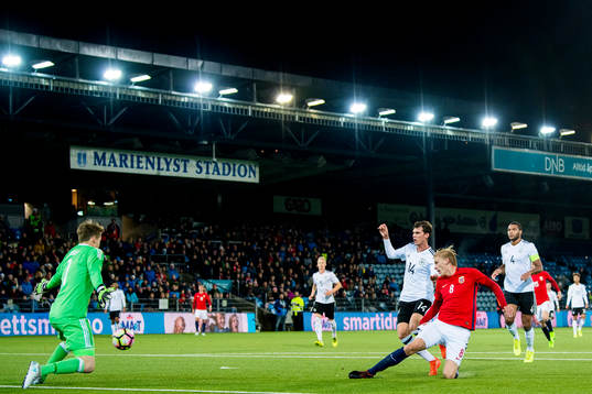 Morten Thorsby of Norway scores 3-1 behind goalkeeper