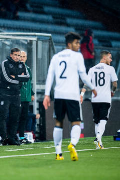 Stefan Kuntz, head coach of Germany, Benjamin Henrichs and