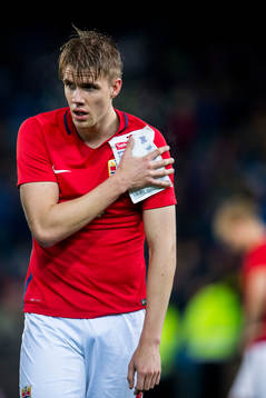Kristoffer Ajer of Norway with an injury