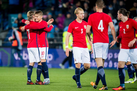 Iver Fossum and Martin Ødegaard of Norway celebrate