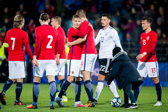 Martin Ødegaard and Kristoffer Ajer of Norway celebrate