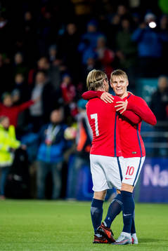 Iver Fossum and Martin Ødegaard of Norway celebrate