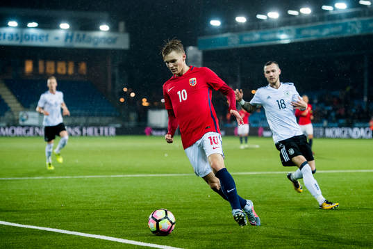 Martin Ødegaard of Norway and Marcel Hartel of Germany