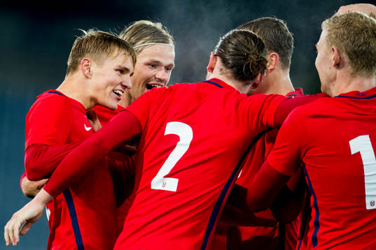 Martin Ødegaard of Norway celebrates with teammates